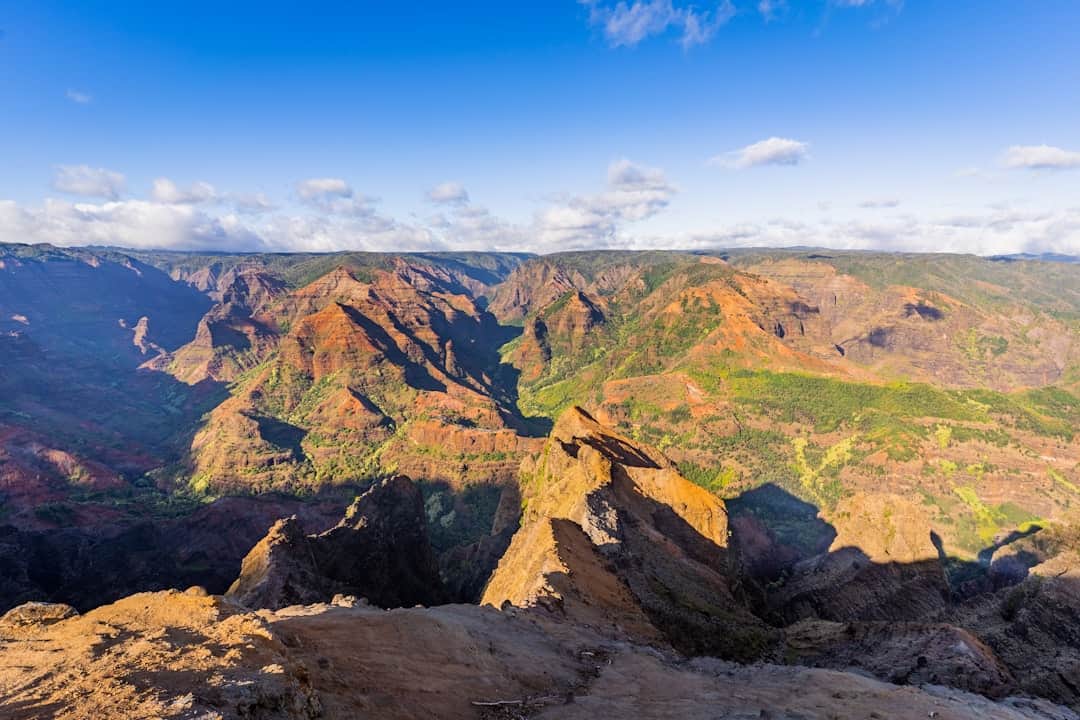 green and brown mountain under blue sky during daytime
