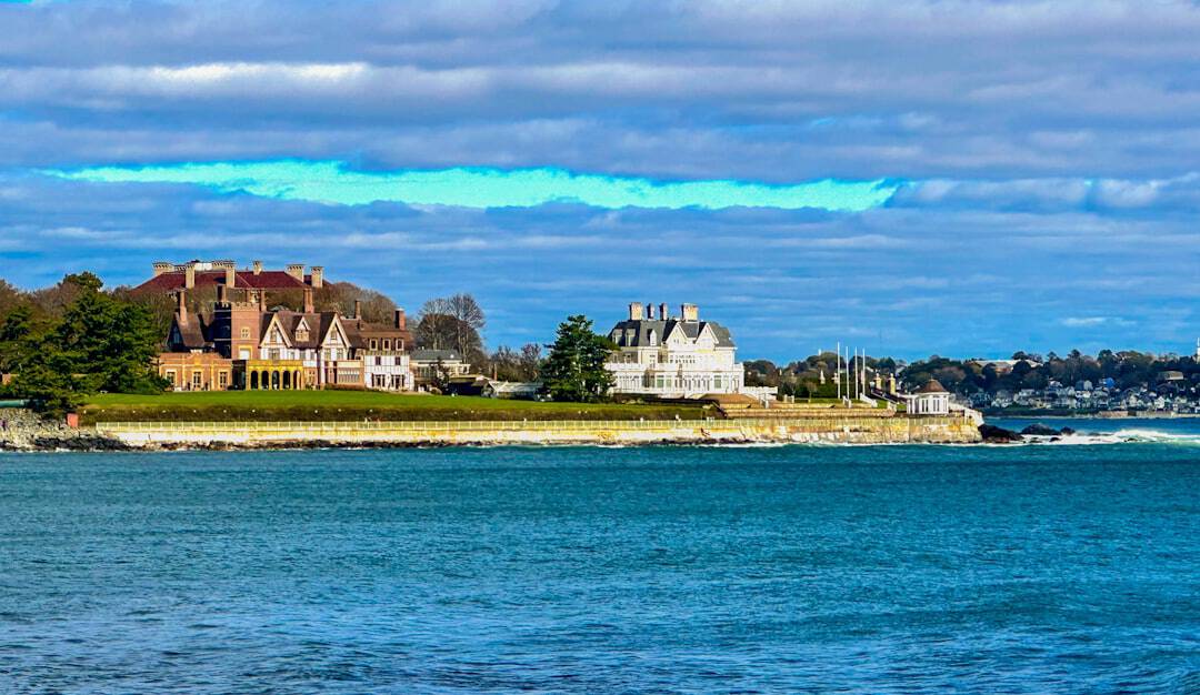 Photo by Rich Martello a large body of water with houses in the background