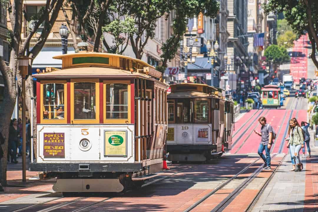 Photo by Daniel Abadia two white and yellow train cabs