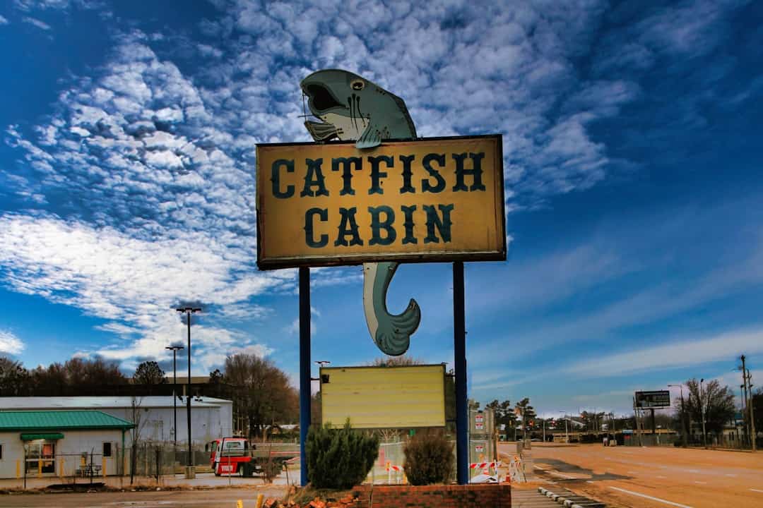 a sign for a seafood restaurant on the side of the road