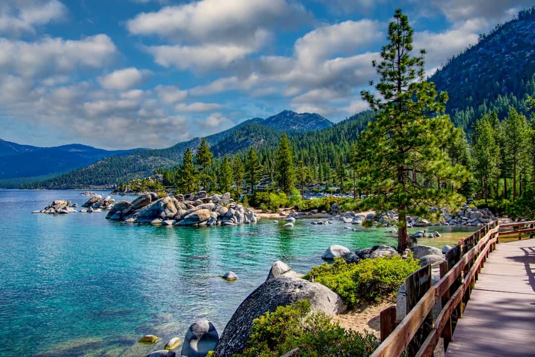 Photo by Stephen Crane a scenic view of a lake surrounded by mountains