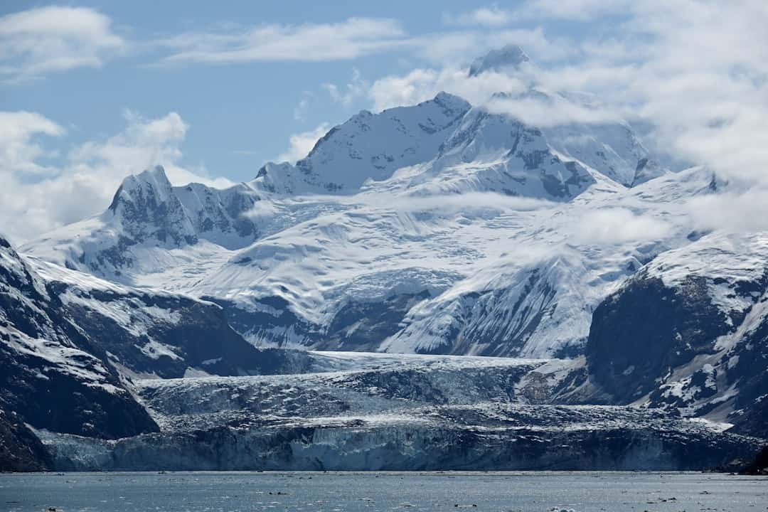 Photo by Elvis Liang A snow-covered mountain and glacier.