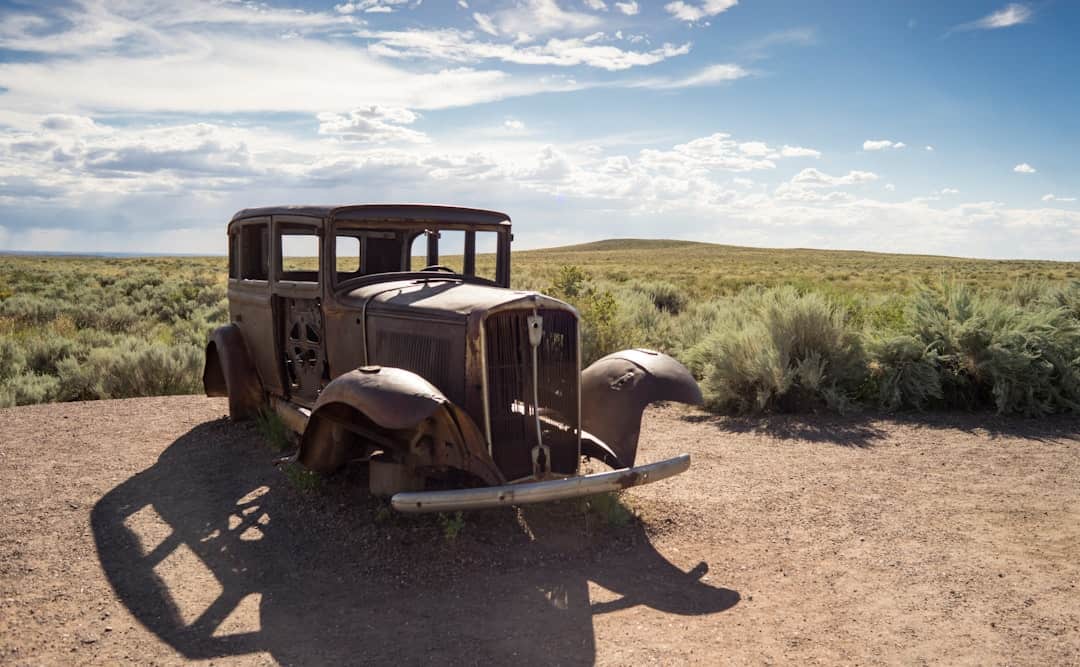 Photo by Jim Witkowski brown vintage car on brown dirt road during daytime