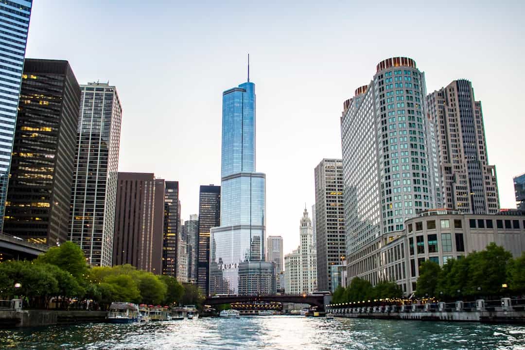 Photo by Gautam Krishnan high-rise buildings near body of water during daytime