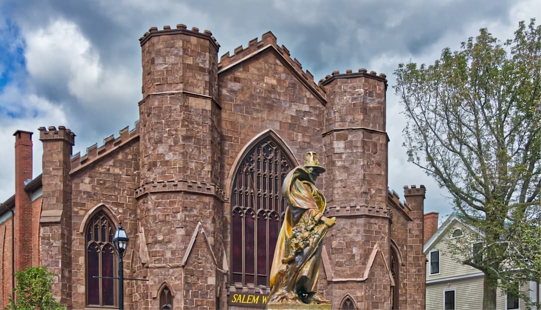 Photo by Pascal Bernardon a large building with a statue in front of it