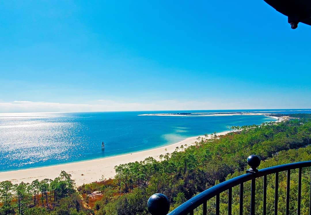 Photo by Kevin Dunlap a view of a beach from a balcony