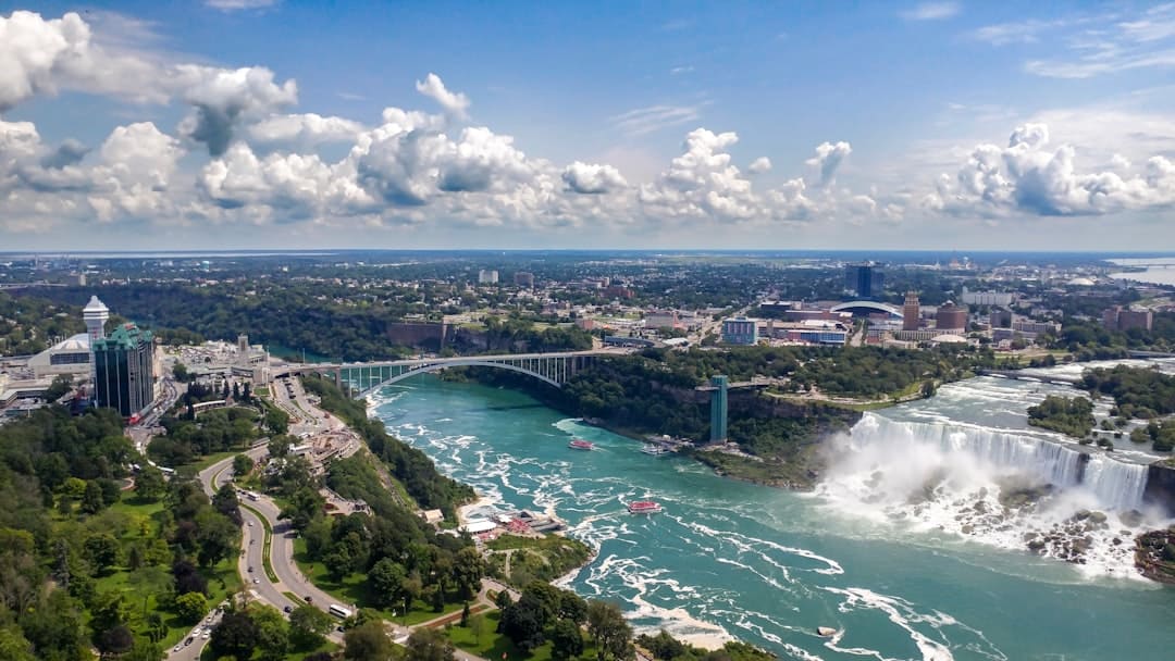 a view of niagara falls and the falls from a helicopter