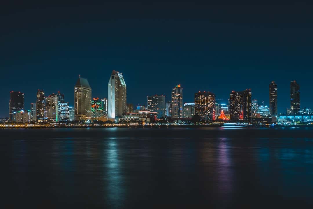 city near body of water during nighttime