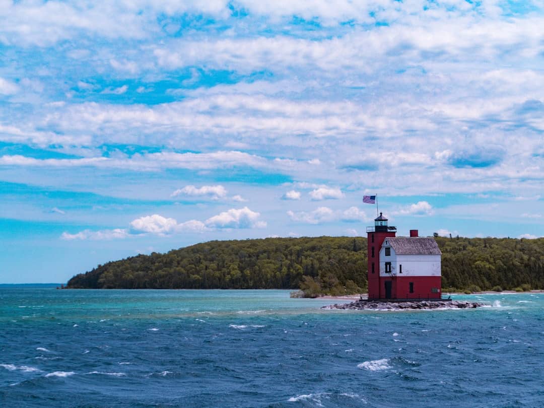 Photo by Aaron Burden red and white lighthouse