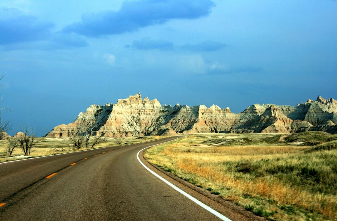 Photo by Matan Levanon brown mountains near road during daytime