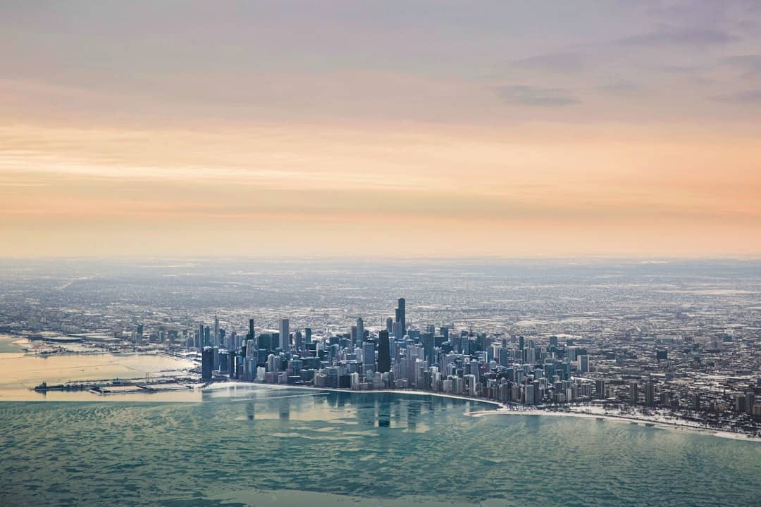 an aerial view of a city and a body of water